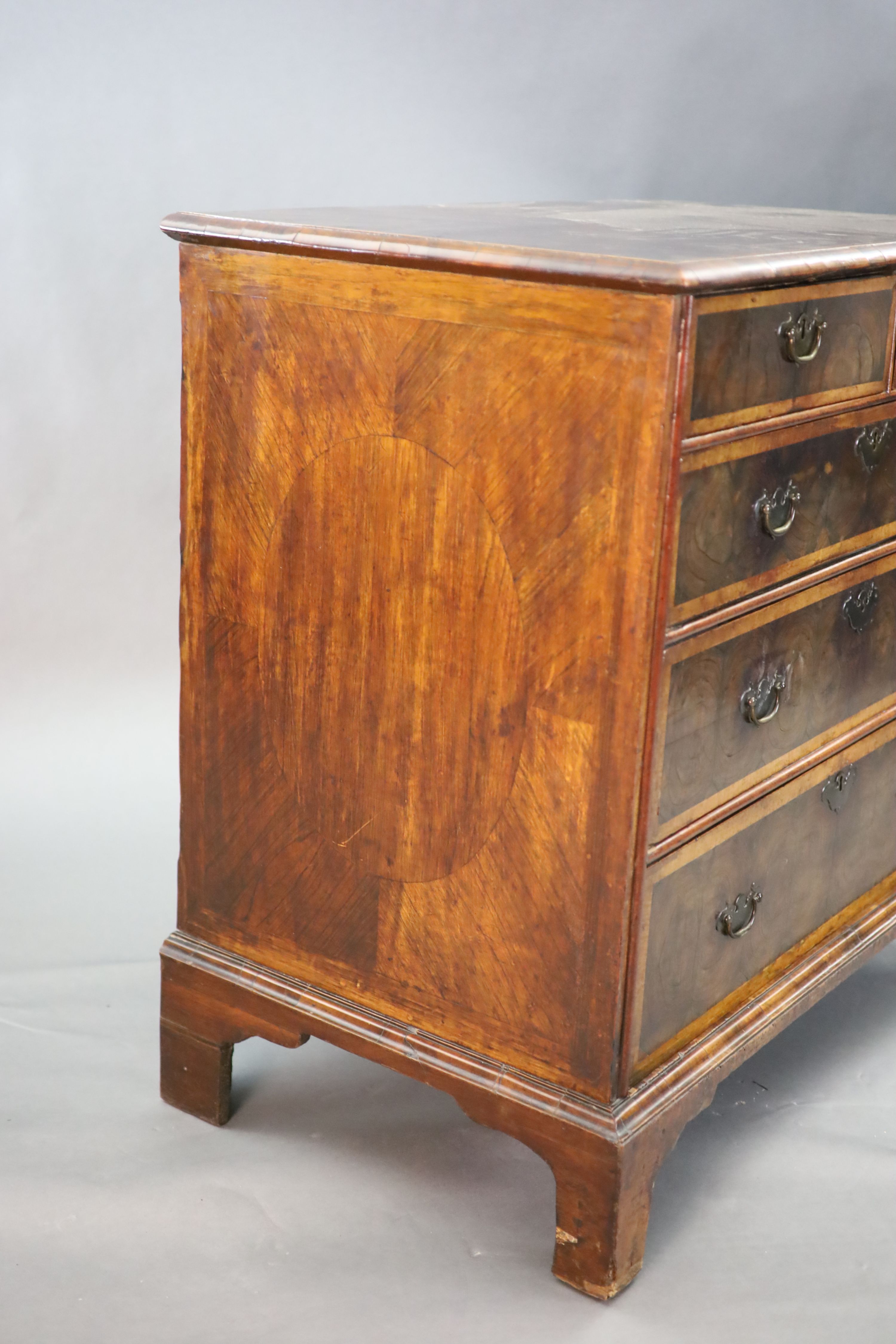 An early 18th century oyster veneered chest, W.3ft .5in. D.1ft 10in. H.3ft 1in.